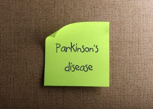 Parkinson's disease written on a post-it note