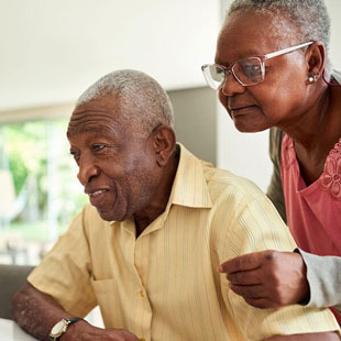 Senior couple looking at information online