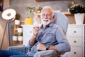 happy-senior-man-holding-oxygen-mask