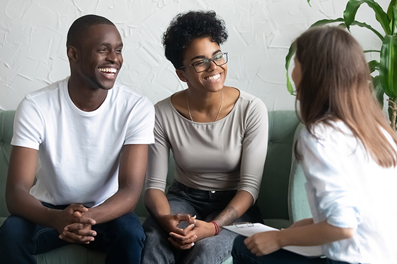 Siblings discussing care options with a caregiver