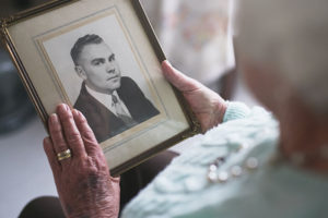 A woman grieves over her deceased husband, a precursor to broken heart syndrome.